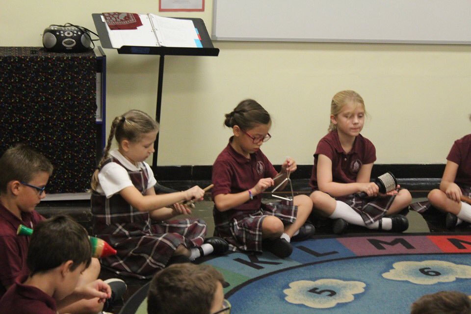 StBenedictPrep's tweet photo. Mrs. Johnson's second grade music class today worked on steady beat and review of classroom percussion instruments. 

Among the "7 C's" of a St. Benedict Prep education that the Music program supports is Creativity.
#stbenedictprep
#youthandmusic https://t.co/MS6xfUVSB1
