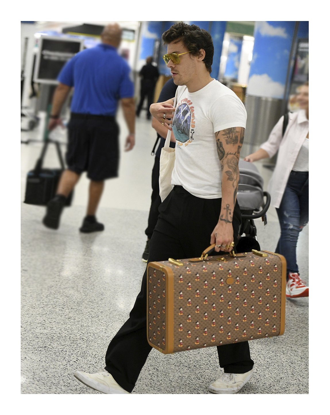 gucci on X Harry Styles who stars in the GucciMemoire d une Odeur campaign seen on GucciBeauty spotted with a GucciCruise20 mini Disney X Gucci GG suitcase with Mickey Mouse print GucciEyewear acetate...