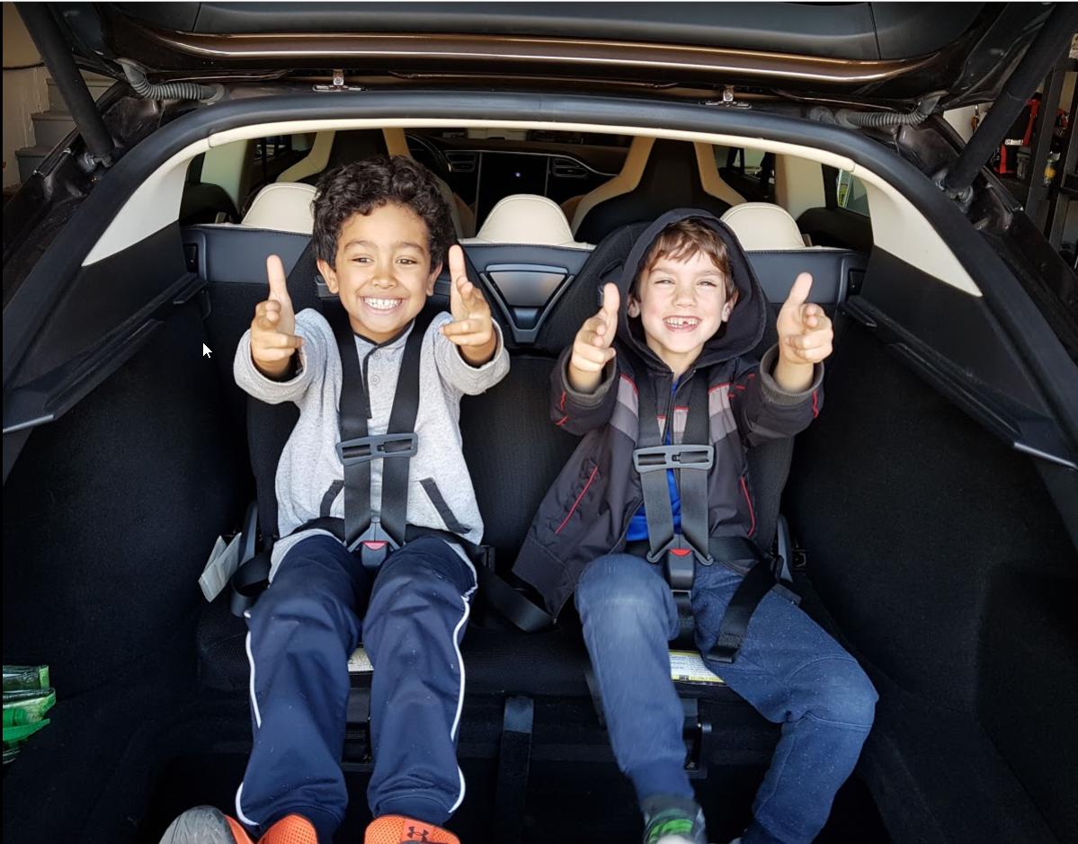 comeaujo's tweet image. Kids love @Tesla's (and guns apparently)

#ev #evtravel #models #jumpseats #seats7 #spaceship #electricvehicle #zeroemissions #kickgas