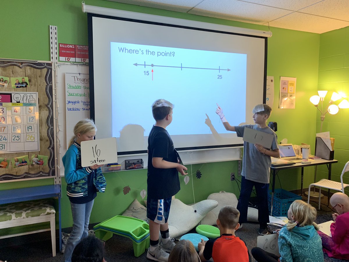 MissBurkley's tweet photo. Mathematicians justifying their answer for what number they believe the arrow is pointing to. Encouraging each other as we discuss! #mathtalks #EEinkee https://t.co/iirui8dxzG