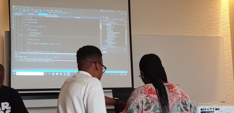 TiyaniTee's tweet photo. On this day last year, our then Minister of @thedpsa, @MinAyandaDlodlo was learning how to Code with C#, guided by @skinnyshugo. She built an application that launched the South African National Public Service Hackathon: #IgniteHack.
She LIVE coded in front of over 200 Geeks. https://t.co/aAia3yXbrM