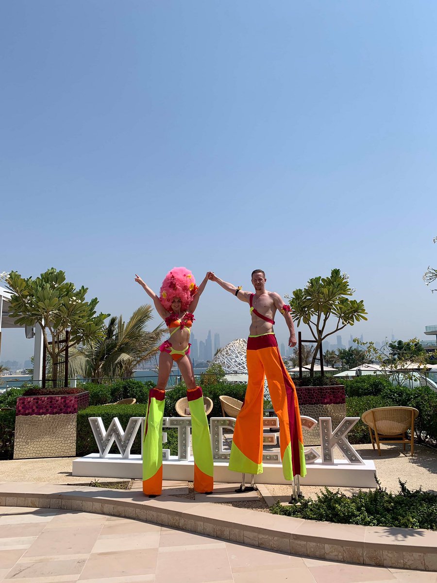 Area51crew's tweet photo. Check out these awesome shots of our duo at @wetdeckdubai 🔥☀️
We know they’re enjoying the sunshine whilst we sit in the office in the rainy UK receiving their amazing pictures 😅 
☀️❤️
#dubai #entertainment #stiltwalkers #wetdeckdubai #dubaientertainment #globalperformers https://t.co/ehsrpqN2nV