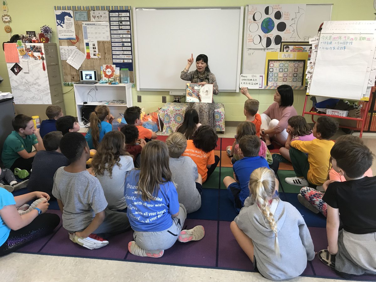 ISD742's tweet photo. Jianling Yin, a Chinese writer of children's literature and is now senior editor of the Shanghai newspaper Xinmin Wanbao visited @madison742 reading to each Chinese Immersion classroom. @kflynnpassion @mer_boucher #lovetoread #read #chineseimmersion #IAMMadison #IAM742 https://t.co/V3P892VIOT