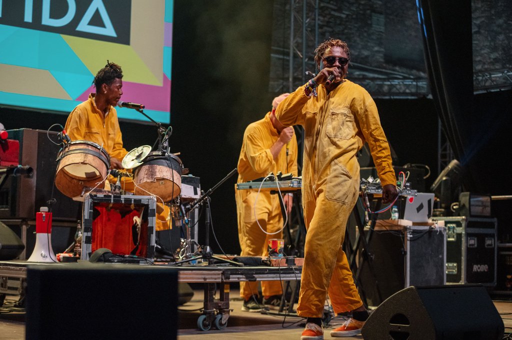 .<a href="/KOKOKOmusic/">KOKOKO!</a> performing on-stage with an array of different instruments, including keys, drums and electronic production to create their unique sound!