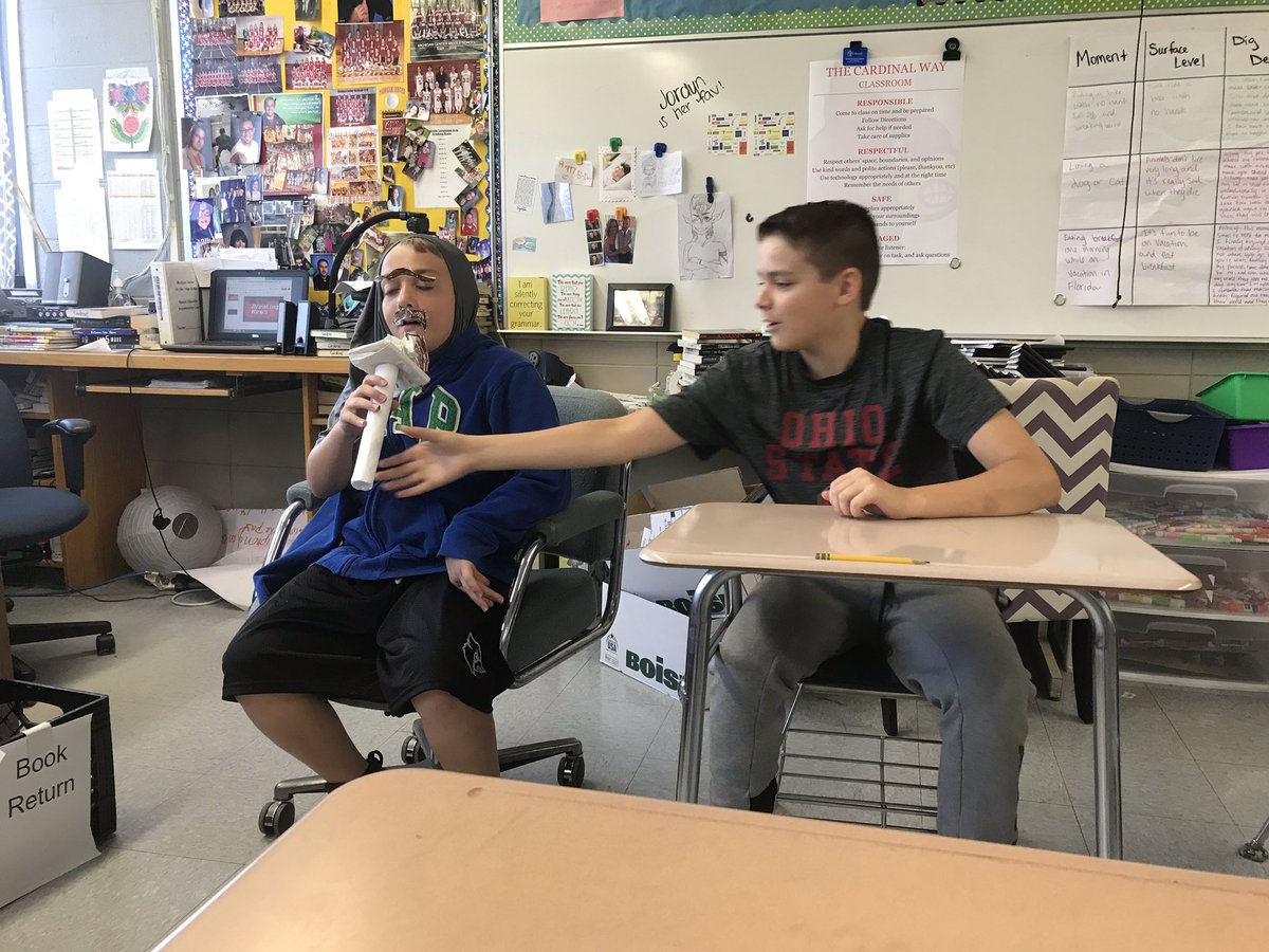 kmcardenas's tweet image. The daily news sometimes requires a makeshift mic and some facial hair. #7thgraderocks