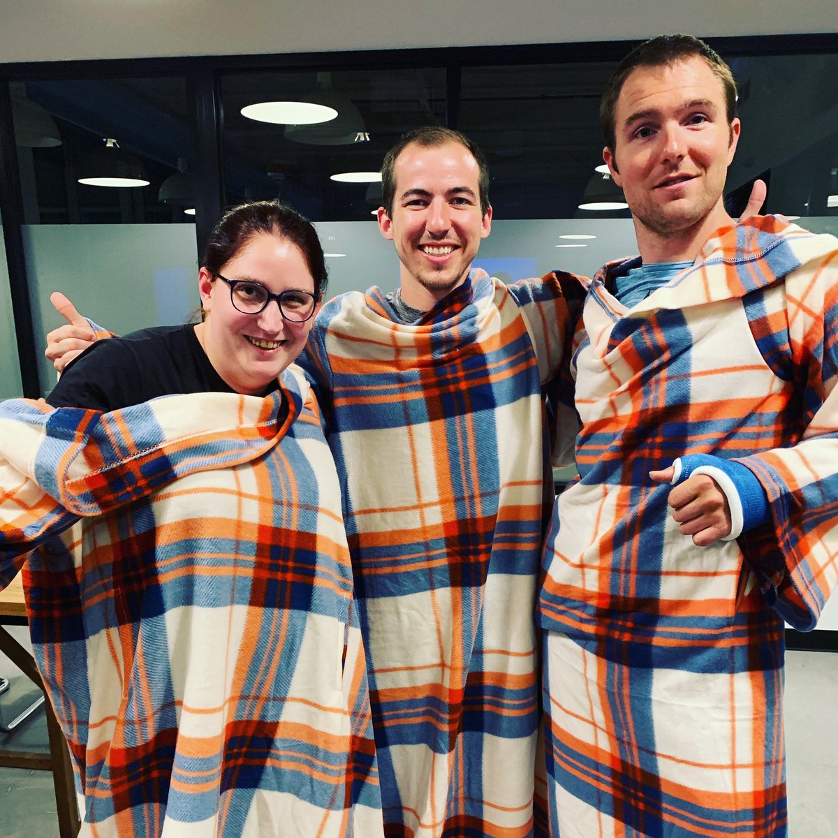 namedotcom's tweet image. With the theme summer.rip, our #hackthedot winners were adorned with high Snuggie fashion. @flatironschool @WeWork #hackathon
