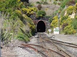 from the factory to the launch site. The railroad line from the factory happens to run through a tunnel in the mountains, and the SRBs had to fit through that tunnel. The tunnel is slightly wider than the railroad track, and the railroad track, as you now know, is about as wide