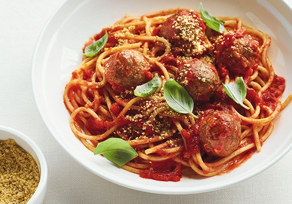 The "meatballs" in this spaghetti dish consist of eggplant, breadcrumbs and chia seeds...and the whole is topped with a sprinkle of #vegan parm! bit.ly/2mlPCb7