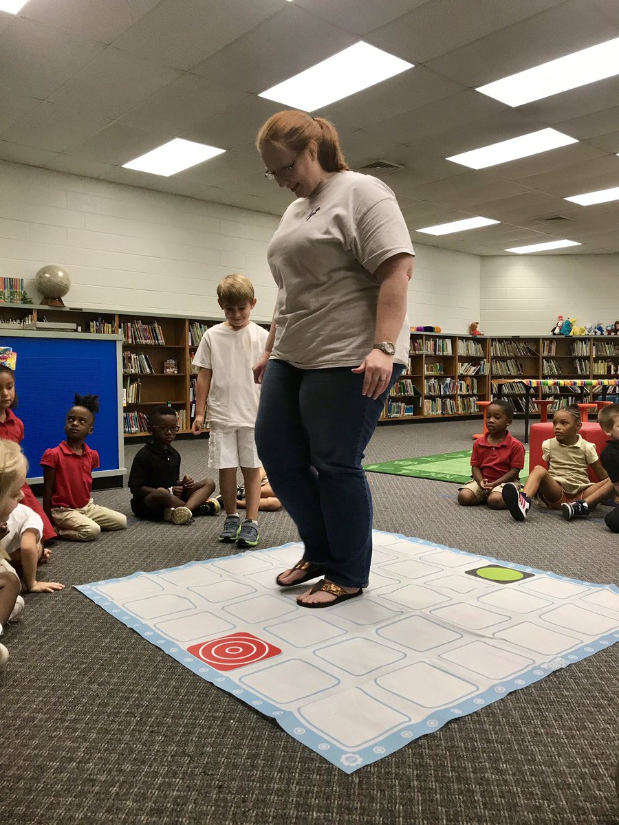 kinder_cain's tweet photo. All smiles during our coding lesson this morning! @AbbiGriffin1 was our robot! @SPARK_STEM https://t.co/wGG0XdSRw4