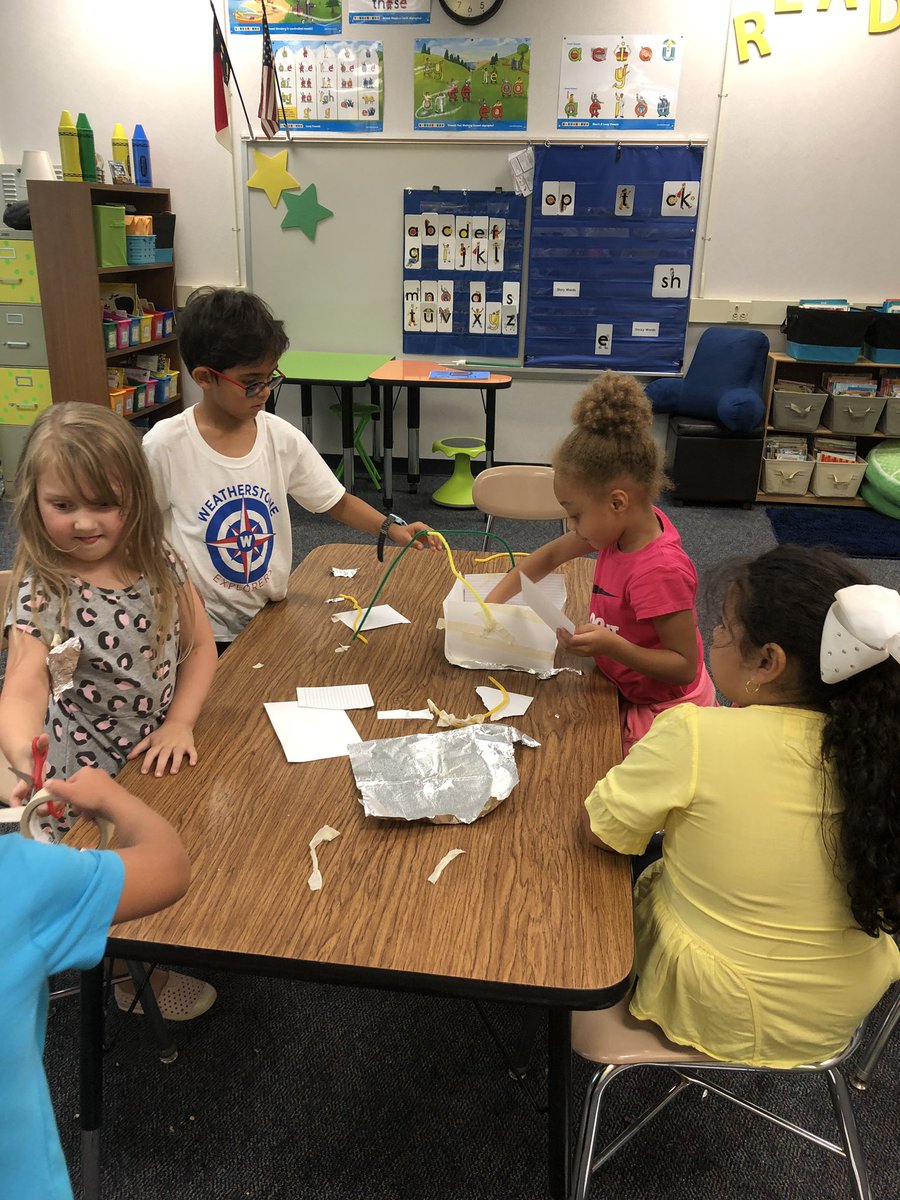 Teamwork at its finest!  Building basket to carry apples.