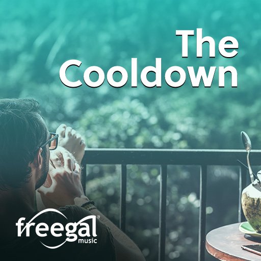 a man drinking coffee on a balcony overlooking a forest