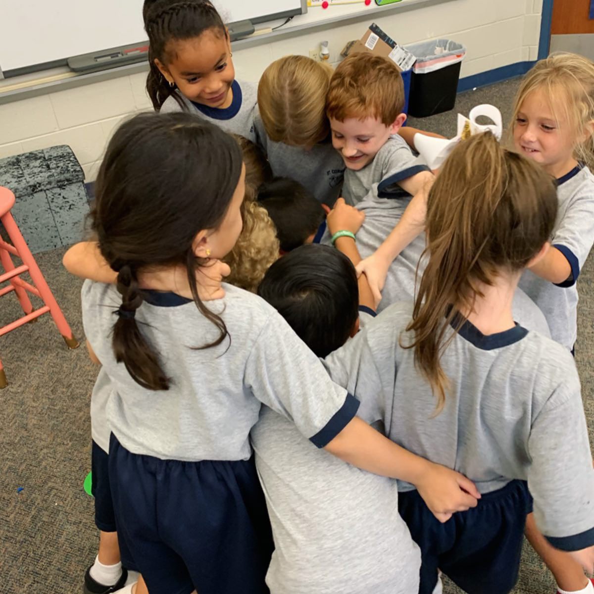 After finishing a test this afternoon, our 1st graders asked if they could congratulate each other for working so hard by having a group high five and group hug.  These pictures hardly capture all the sweetness of the moment! We hope everyone has a weekend as sweet as this!