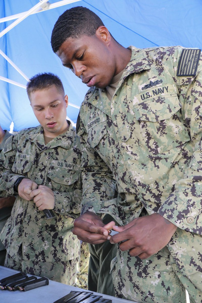 USPACOM's tweet photo. @USPacificFleet sailors with #NBU7 participate during a #smallarms weapons qualification course on the flight deck of the amphibious transport dock ship USS Green Bay #LPD20. #readiness #lethal #ForgedByTheSea #FreeandOpenIndoPacific https://t.co/DzxBbNVKy4