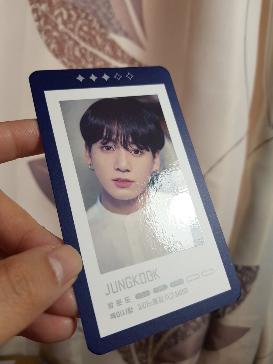 Playcards have a matte border and back, yet a glossy finish where the picture is. Similar to wings and young forever. The blue border has silver specks throughout. Similar to the silver text in the card.