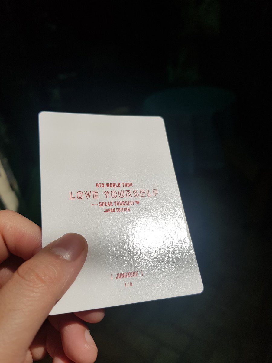 The real one has a yellowish cream colored back. Fake ones are almost white. The text are in very bold red, and are quite sharp. Notice how under sunlight, the fake one almost has a pinkish hue? Also, the texture. Under light the real one has a texture, fake one is smooth.