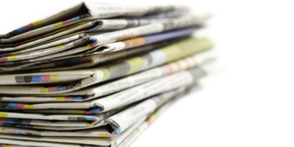 Find a paper. Heap of newspapers.