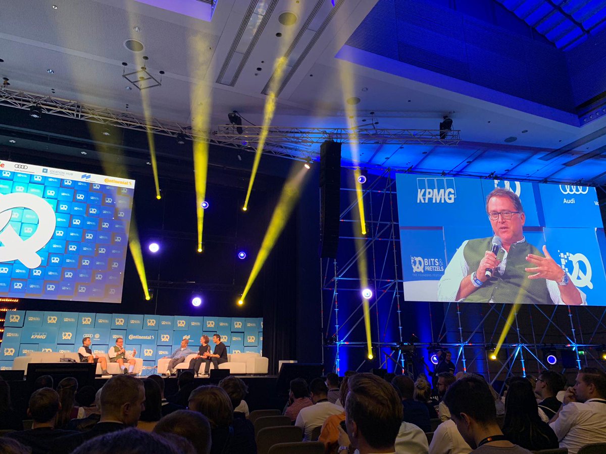 Nenad from DN Capital at Bits and Pretzels with his Shazam socks on stage.