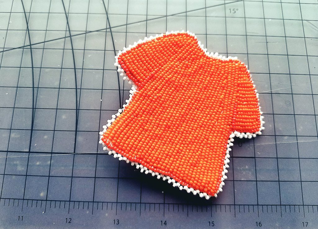 For #OrangeShirtDay I made this beaded pin. Beadwork isn't just symbolic imagery, but can tell a story of culture, history &amp; resilience. #EveryChildMatters