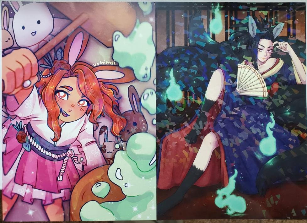 Whoops, I forgot to post this last week but the prints came in!  Our artists really did a wonderful job with these and the holo effect makes their wonderful art stand out.  More merch should be coming in this week so keep an eye out!