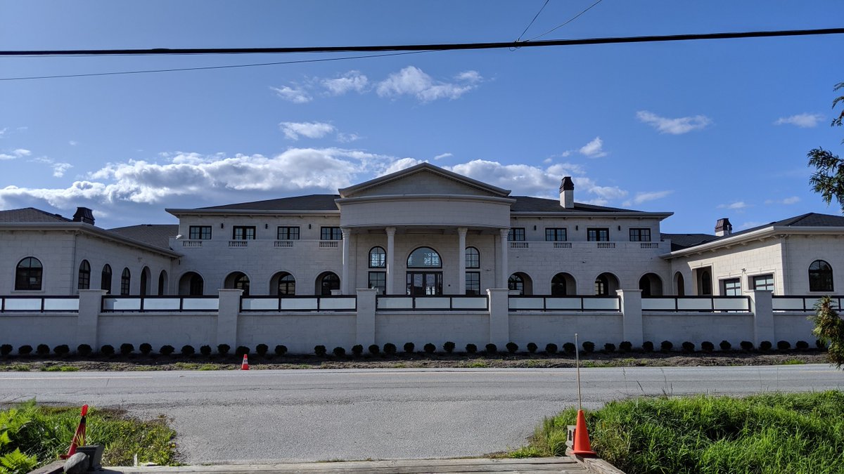 FARMWATCHBC's tweet photo. This week we feature mansions currently under construction on #ALR #farmland. These had until Nov 2019 to build before new legislation puts an end to this destructive practice in #BCpoli. This one just took down the hedge for the big reveal. https://t.co/gt3qwDxoB2