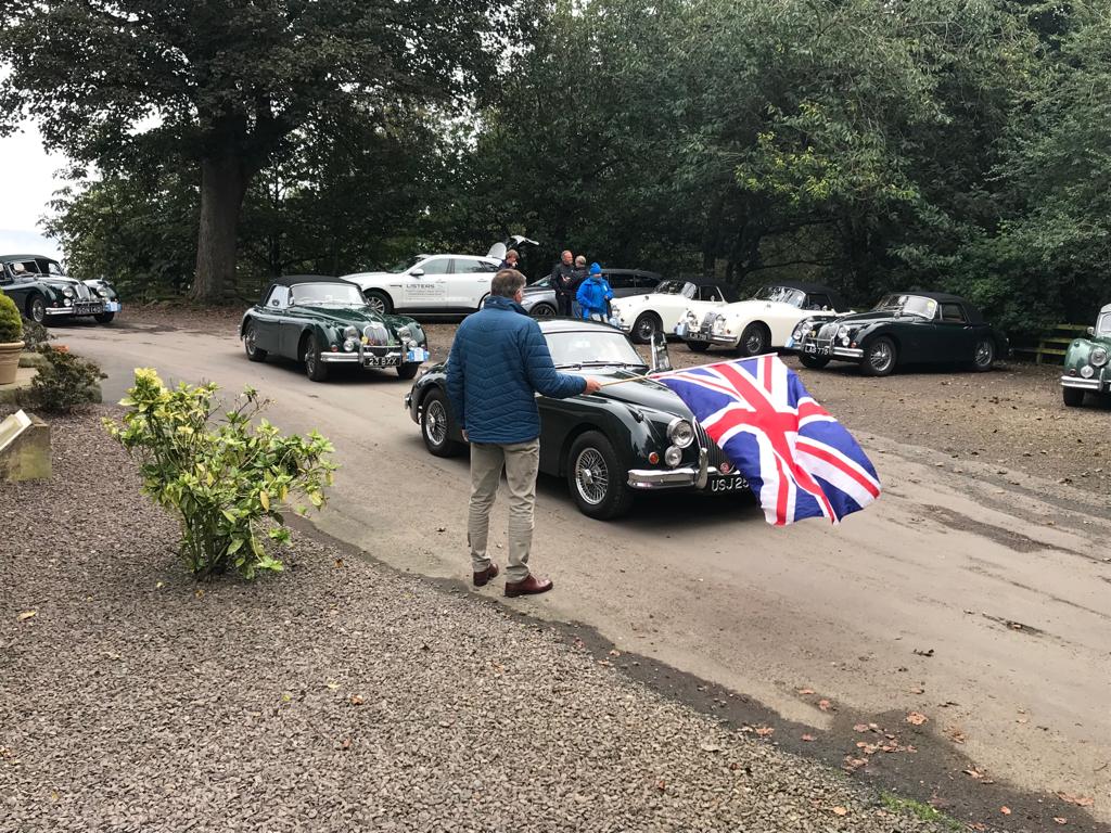 XKClubRBCD's tweet photo. RBCD Stage 14. Paul Whitfield flagging away from Marshall Meadows Hotel, Berwick, with David Kenworthy and Peter Thornton in the Yellow Hats. 
@ProstateUK 
@sngbarratt 
@ListersJLR 
@TwyfordMoors 
@XKClub
#berwick
#northumberland https://t.co/v3ChjCB5C5