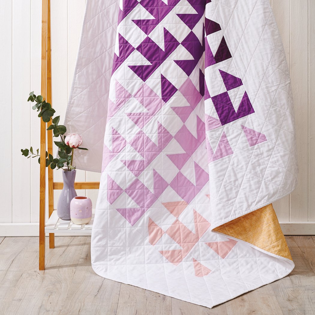 From the deepest aubergine to the lightest lilac, piece an ombre assortment to make Tiffany Horn’s bright, breezy quilt, only in issue 78