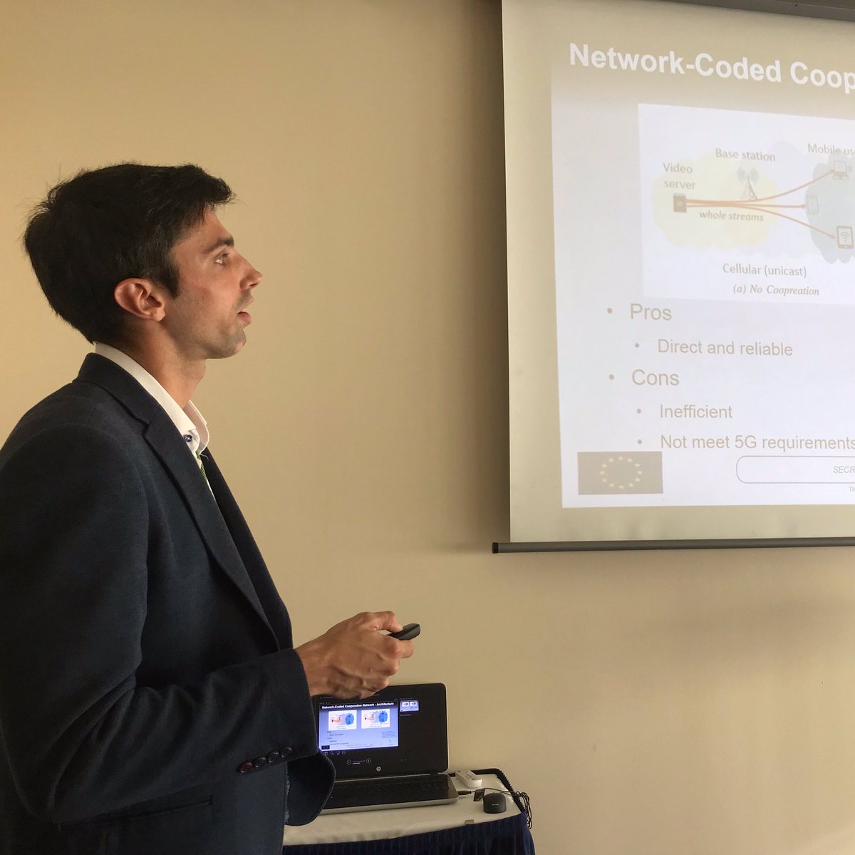 H2020ITN_SECRET's tweet photo. Roberto Torre (@RobertoTorre5G) presenting his @H2020ITN_SECRET paper entitled “Evaluating the Latency Overhead of Network-Coded Cooperative Network for Different Cloud Sizes”. #itn_secret #msca #5gwf #5gsummit https://t.co/TLmblYvDL0