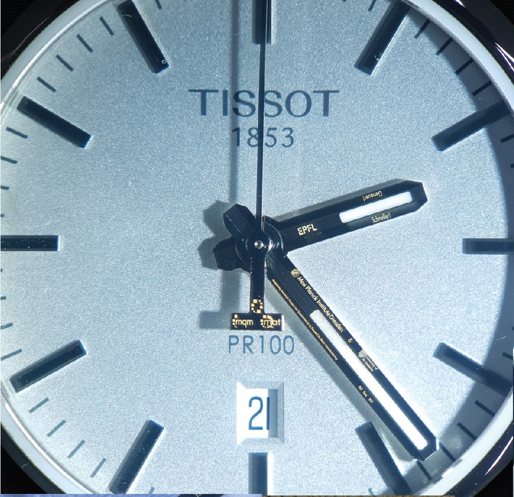 EPFL_QMAT's tweet photo. In order to prepare a truly unique gift for former student Maja Bachmann, QMAT collaborated with Swiss watchmaker Marc Jenni and used focused ion beam micro-machining to engrave the hands of this watch with sub-micrometer precision.  @jenniwatch https://t.co/OG1ZoPKZOn