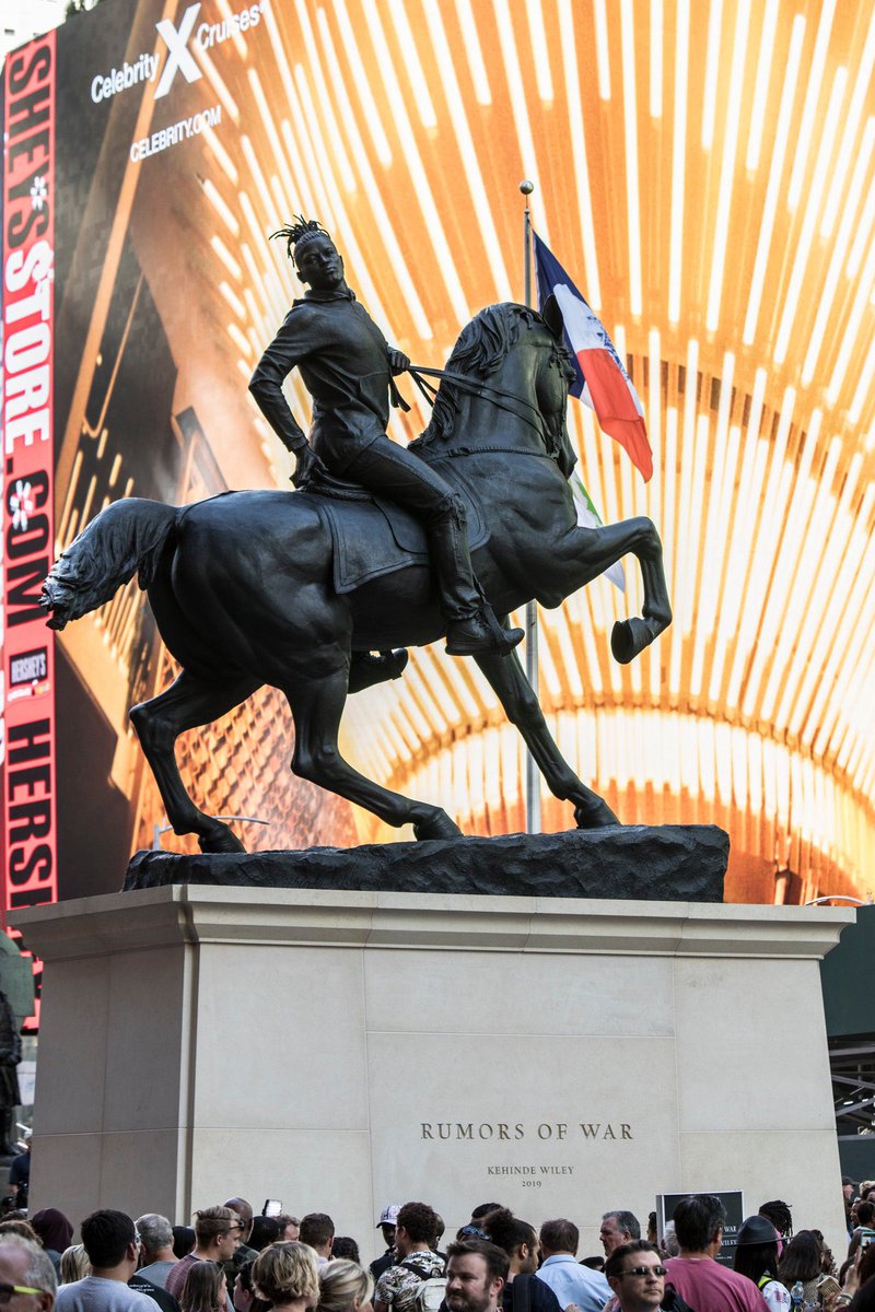 Kehinde Wiley’s new 30ft sculpture called “Rumors of War” was unveiled in Times Square last week. It features a Black man wearing locs, jeans + a hoodie. It’s a reclaiming of American history...Kind of an opposition to all those weird confederate sculptures in the south 