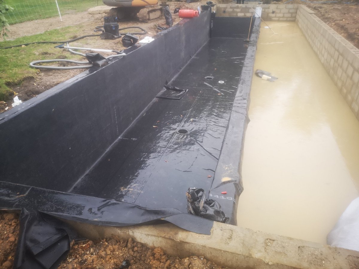 lakeandpond's tweet photo. Liner going in despite the rain https://t.co/DYbchGjd5H