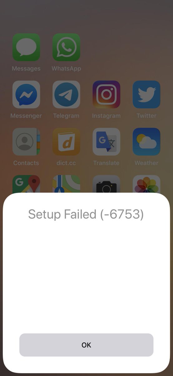 Screenshot of an iOS homescreen, overlaid by a modal with the title "Setup Failed (-6753)" and nothing further. 