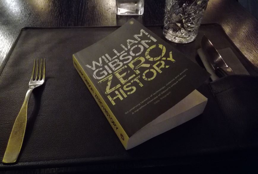 The_Laaksone's tweet photo. Waiting for the main dish I noticed from the corner of my eye a person from the next table turning halfway toward me and signaling their friends to have a look at the man who dared to read in a restaurant. But then I had to turn the page already. @GreatDismal #ZeroHistory https://t.co/h5Djt27qWk