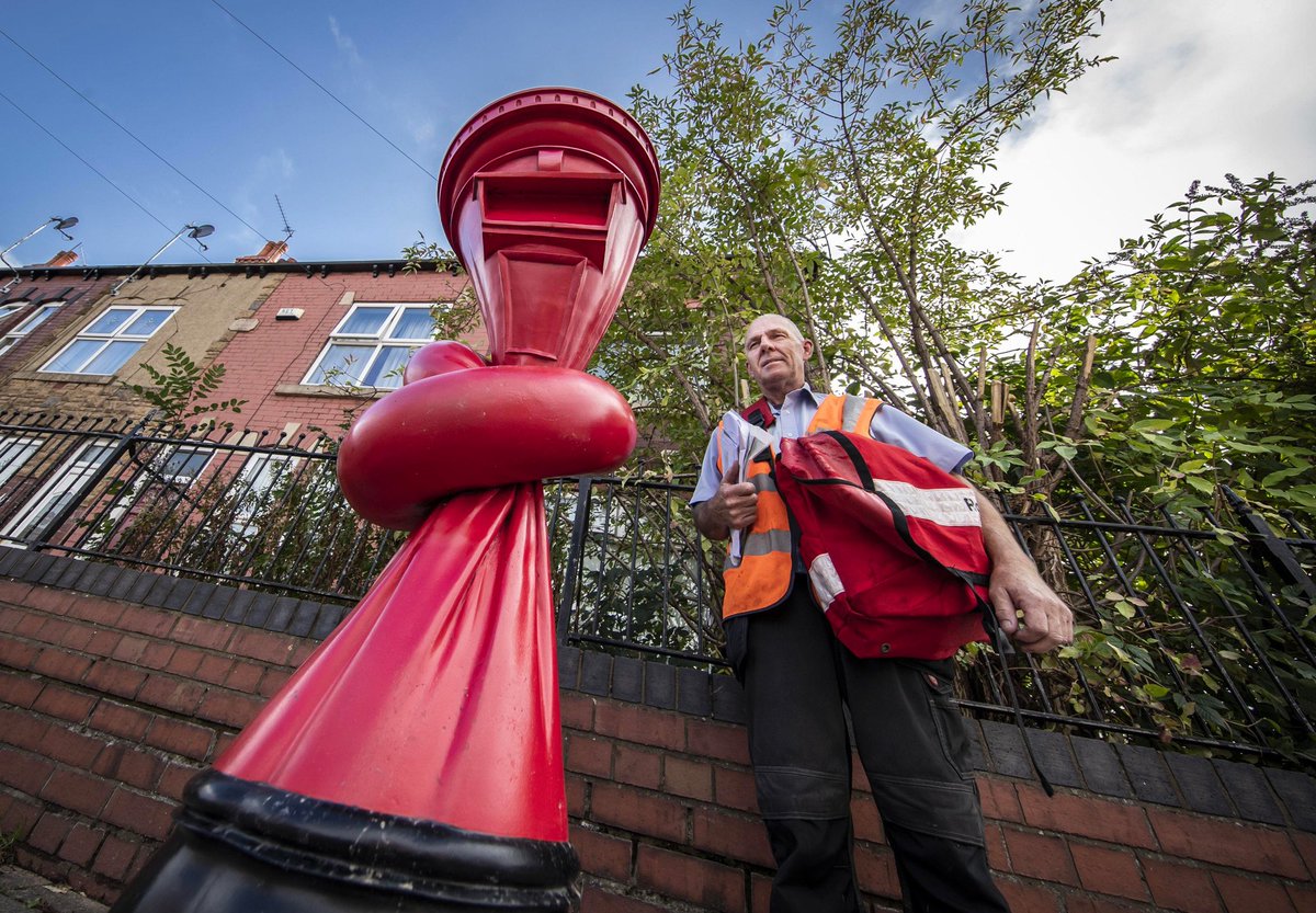 thisiscolossal's tweet photo. The U.K.’s Iconic red post box gets a twisted makeover in Alex Chinneck’s surreal urban interventions
 https://t.co/dEQaBLHlJ5 https://t.co/OULzSOSNWc
