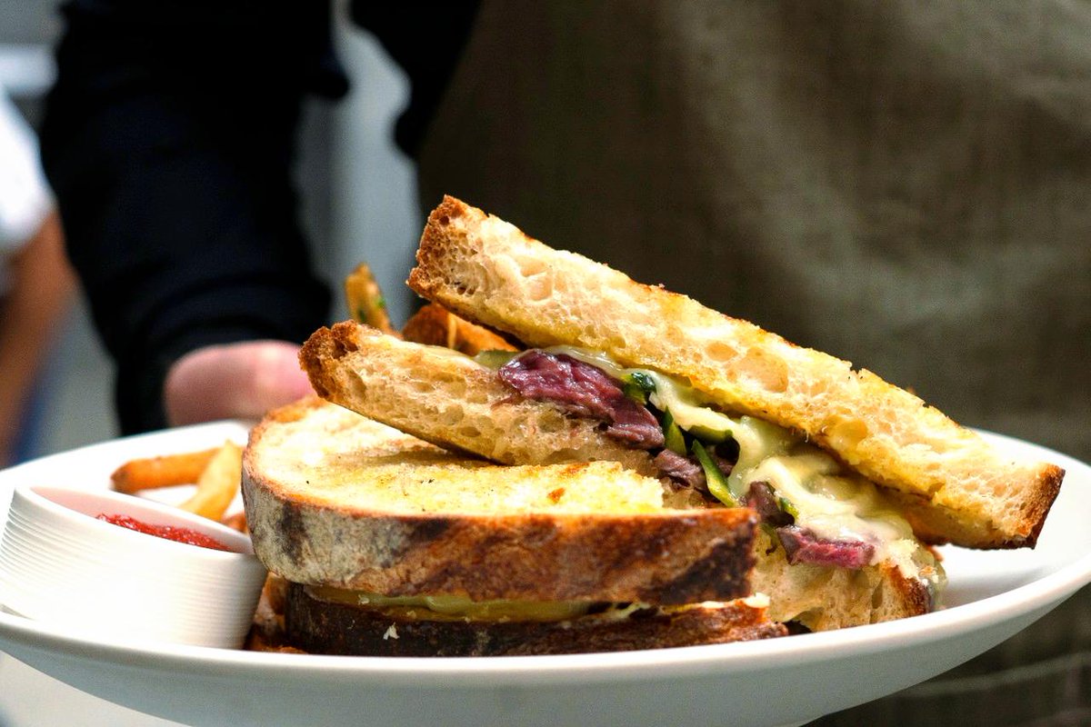 Satisfy your cravings with our Grilled Steak Sandwich, with prime steak, garlic aioli, white cheddar, pickled poblano, and fresh horseradish! #YesPlease #PrimeSteak #SandwichTime #Lunch #SantuariLa