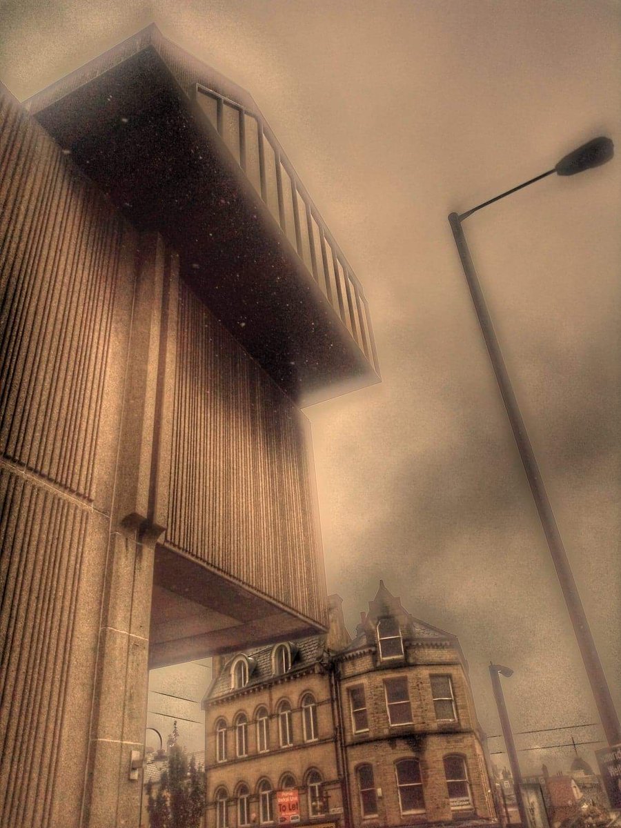 absurdlyso's tweet photo. a bit unusual this one. taken this morning in low-flying rain. a robot. a watchtower. transformer. peaky blinder. lots to the imagination. #bradford kirkgate #strangeimages https://t.co/7VCVgbYdNG