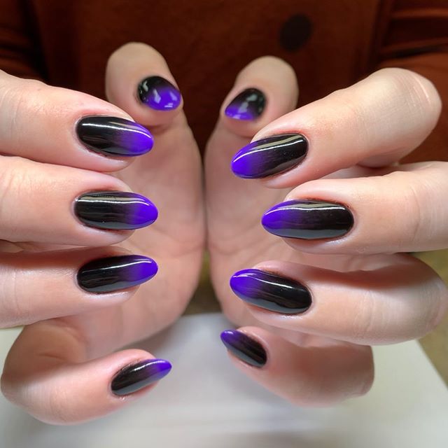 These black to purple ombre nails are giving us evil queen vibes. #ombrenai...