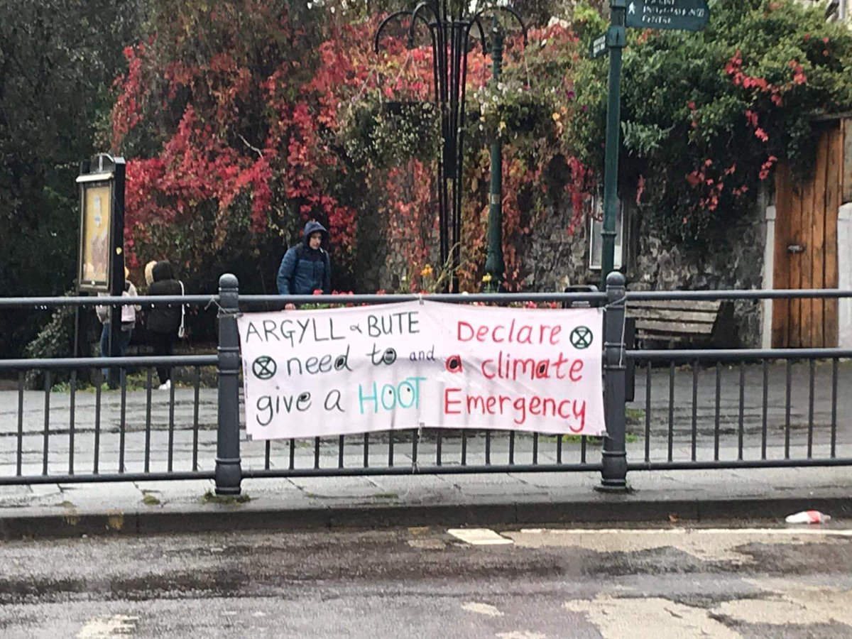 ScotlandXr's tweet photo. While the #InternationalRebellion has been taking over London, #XRScotland rebels back home have been busy. @XRHighlands march and die in for animals in Nairn, banners in Oban, outreach in Edinburgh and East Dunbartonshire demanding #ClimateEmergency declaration from @EDCouncil https://t.co/YNWC2Fw2B8