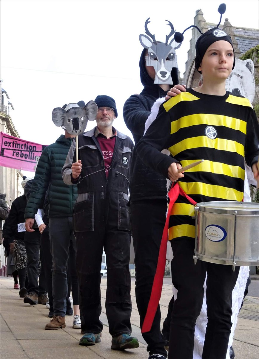 ScotlandXr's tweet photo. While the #InternationalRebellion has been taking over London, #XRScotland rebels back home have been busy. @XRHighlands march and die in for animals in Nairn, banners in Oban, outreach in Edinburgh and East Dunbartonshire demanding #ClimateEmergency declaration from @EDCouncil https://t.co/YNWC2Fw2B8