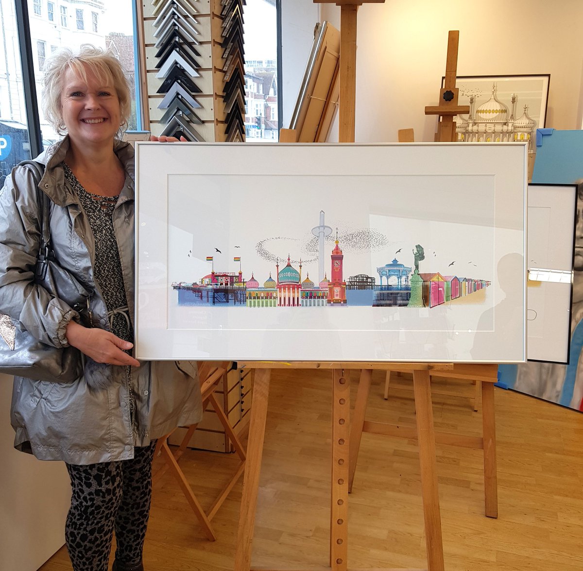 UniqueArtsUK's tweet photo. Another happy customer has just collected her Brighton is Beautiful artwork by Ilona Drew @ilonadrewthis Available mounted or framed https://t.co/KJ6NUuR9o1 #brighton #brightonandhove #artgallery #fineartprint #contemporaryart #brightonlandmarks #graphicillustrations https://t.co/pov8URfiS5