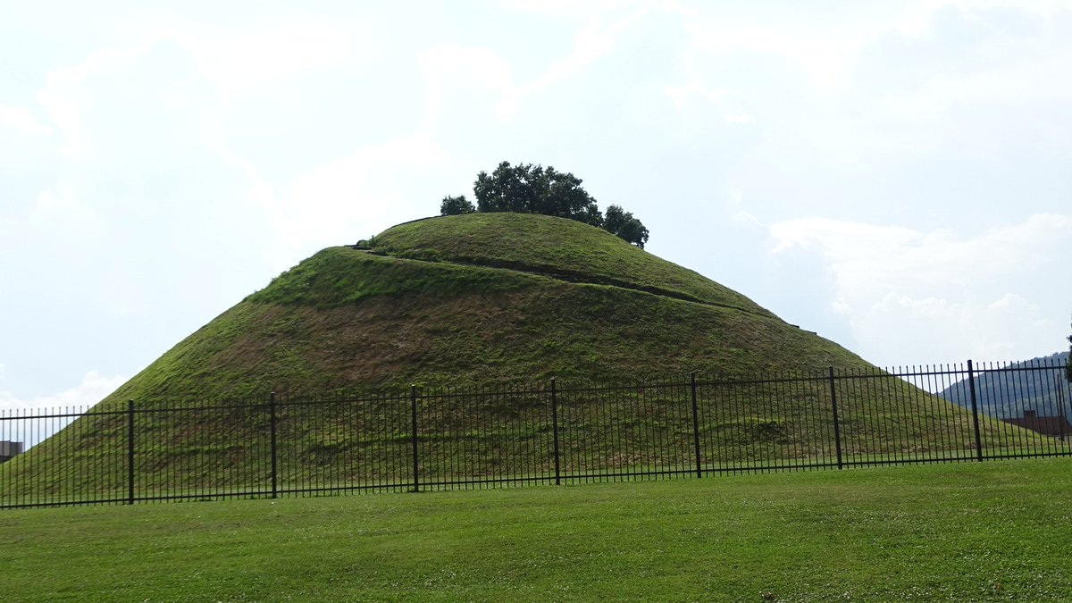 <a href="/happytrailshike/">Happy Trails Hiking</a> <a href="/HikeAdventures/">Gleason Adventure</a> <a href="/YankeesAdv/">Yankee (Maèxelawèn Osapèkwinùnt)</a> <a href="/karynlocke/">Karyn Locke</a> <a href="/livcuriously/">ConsistentlyCurious</a> @milkwithno <a href="/lnhelton12/">Nikki Dill</a> <a href="/QueenThrifty/">Queen</a> <a href="/Todd_the_Hiker/">Todd Nystrom</a> <a href="/travelinsliving/">Tonya Prater</a> <a href="/yodertoterblog/">Leah Yoder</a> @theamillerryan <a href="/ryderwriter/">Ryderwriter</a> @ShutterbugSage <a href="/ChasingDepartur/">Chasing Departures</a> <a href="/wellworncase/">Well Worn Suitcase</a> <a href="/NebraskaOdyssey/">Gretchen Garrison</a> @OhMyOmaha <a href="/PostcardJar/">Postcard Jar</a> <a href="/TimTrudell2/">Tim Trudell</a> <a href="/WalkingTourists/">The Walking Tourists</a> <a href="/LindaLThomason/">Linda Leier Thomason</a> <a href="/6Kids1Tank/">6 Kids 1Tank</a> Grave Creek Mound Archaeological Complex depicts the burial mounds of the Adena culture.  These mounds can be found throughout the Ohio Valley.