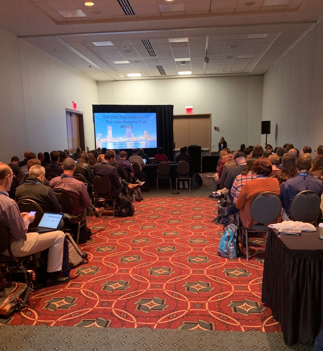 hannon_hill's tweet photo. And she's off! Hannon Hill CEO Kat Liendgens, speaking on digital personalization in Higher Ed and how Clive, our new engagement platform, can assist in your path to personalization #heweb19 #clive #cascadecms https://t.co/nbdSfd2XFk