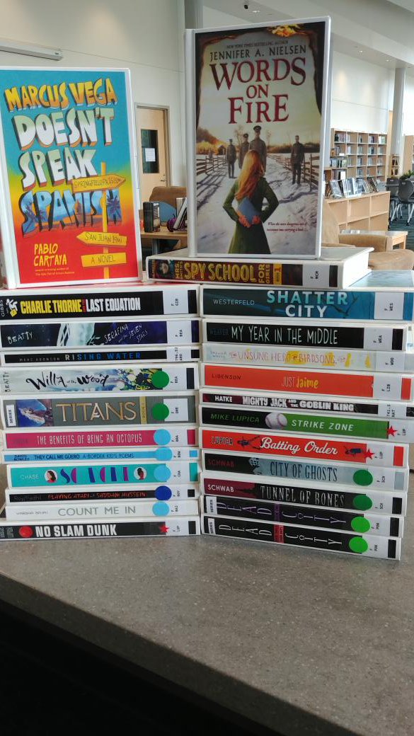 Michal_Hope's tweet photo. New books thanks to #mrmsPTO and Step It Up @mullerroad last spring....#MustangsRead a variety!  #ilovemylibraryjob #r2lms #populartitles #culturallyrelevant https://t.co/cWwXfiGxkW