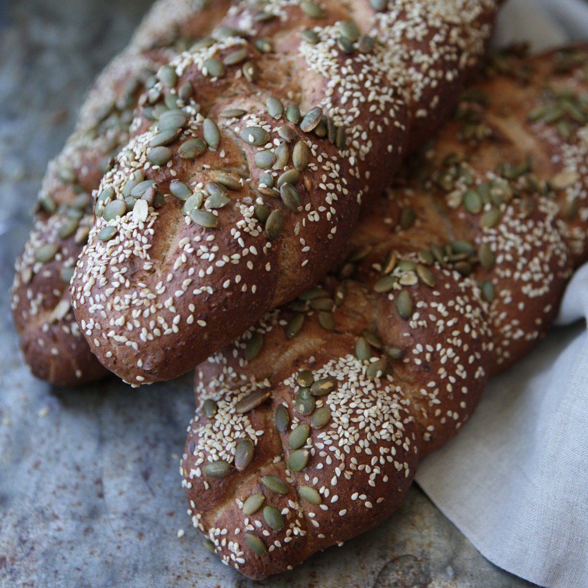 MacrinaBakery's tweet image. German-style Volkorn bread is a seeded loaf perfect for slathering on butter and adding your favorite savory toppings. #macrinabakery #volkorn #germanbread #eatlocalseattle #grainbread #ilovebread #artisanbread