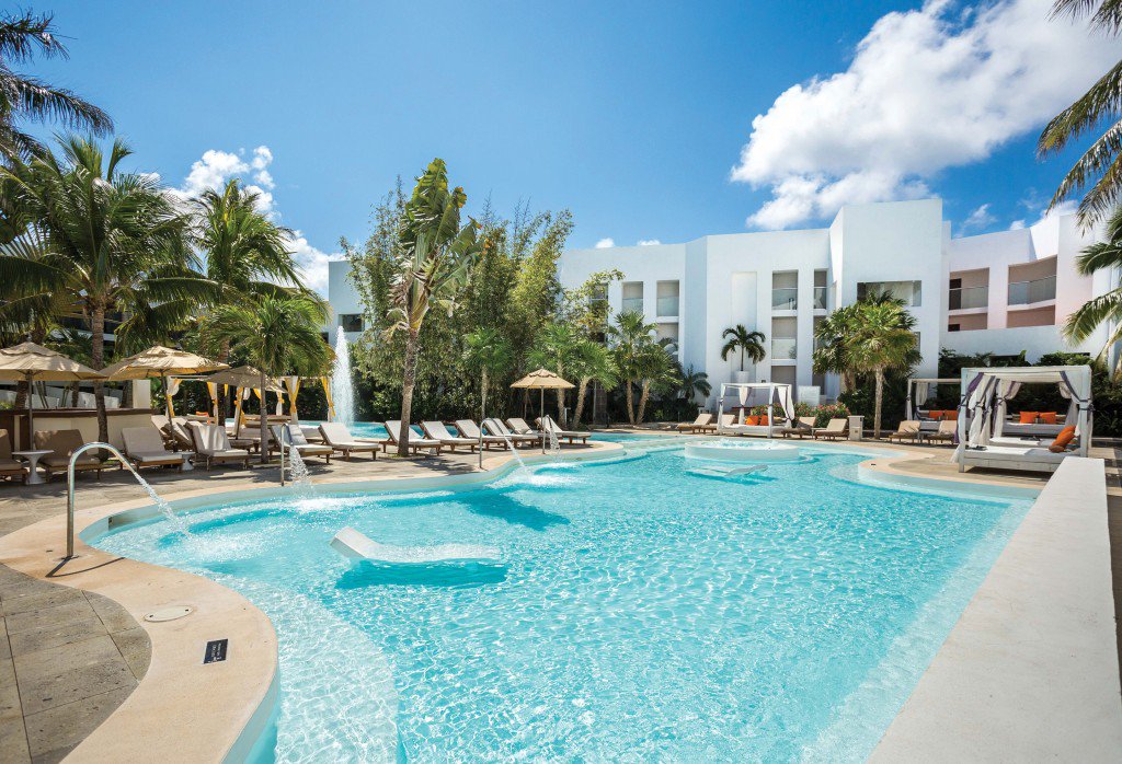 “Relax in the Sun Club Pool at Sunscape Akumal Beach Resort &amp; S...