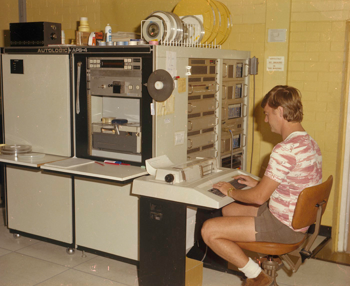men in shorts operating computers