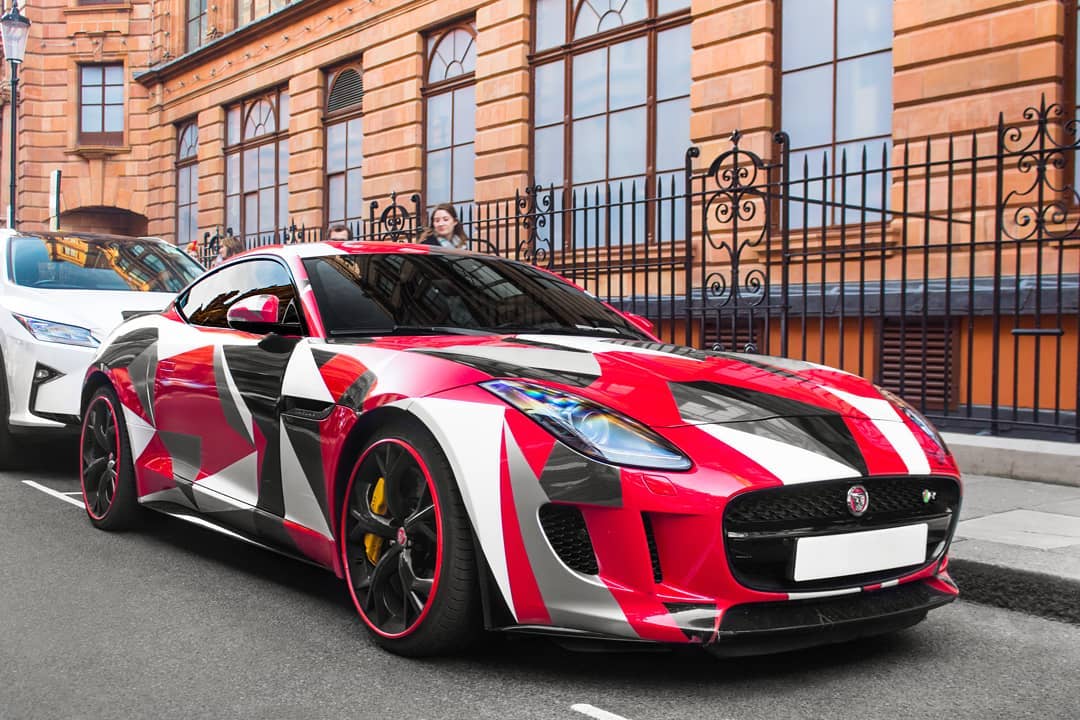 CarCliq's tweet photo. While this Jaguar F Type certainly stands out with this wrap, we canβt help but feel itβs a little over the top? π€ #TastlessTuesday #Jaguar #FType #JaguarFType #wrap #cars #driving #motoring #CarArt #WrappedCars https://t.co/8DeKaxf172