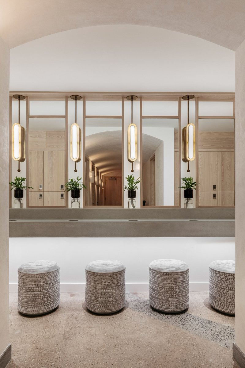 deccori's tweet photo. Curving white-washed wood counters and shelving lined with plants feature inside this member's club in New York City dedicated to wellness, designed by Miami studio Rose Ink Workshop. https://t.co/0QIg7HZkbW