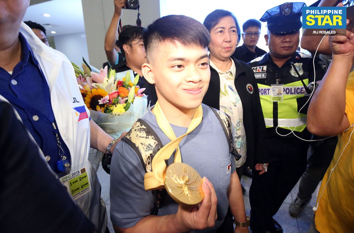 PhilippineStar's tweet image. Olympic gymnast Carlos Edriel Yulo, Philippines' first world champion in gymnastics, was greeted by his family upon his arrival at the NAIA Terminal 3 on Tuesday.