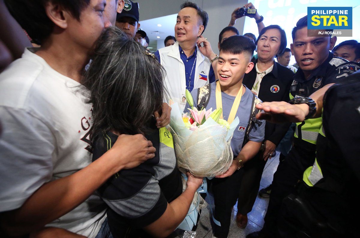 PhilippineStar's tweet image. Olympic gymnast Carlos Edriel Yulo, Philippines' first world champion in gymnastics, was greeted by his family upon his arrival at the NAIA Terminal 3 on Tuesday.