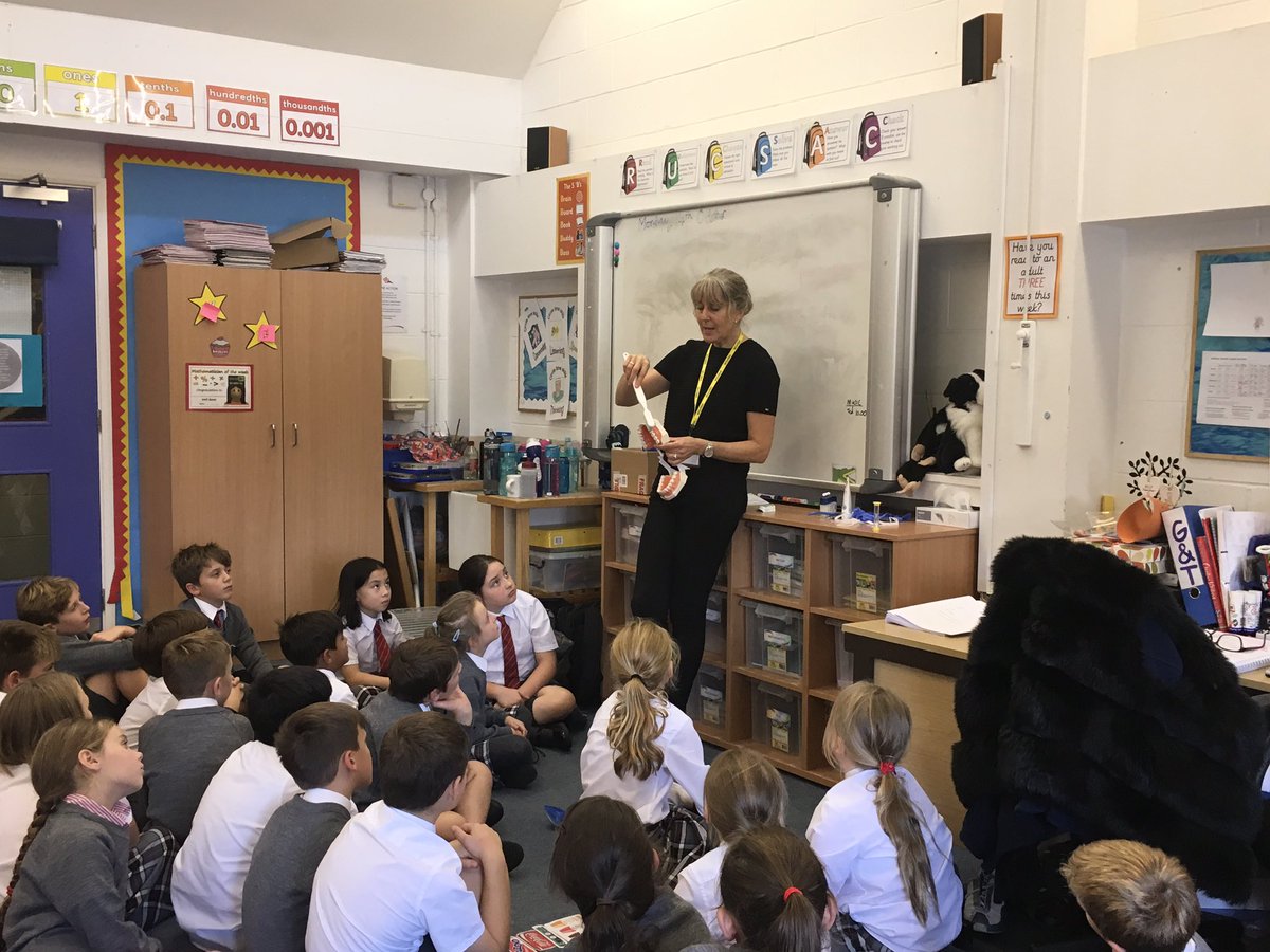 YMS_Year4's tweet photo. Well done to Mrs Towell who was very brave and volunteered to use a disclosing tablet in front of the whole year group. The dentist then explained how to correctly brush our teeth and Mrs Towell did a fantastic job brushing hers! #TeethAndDigestion #ks2 #dentistvisit #science https://t.co/2TLEWFEWDb